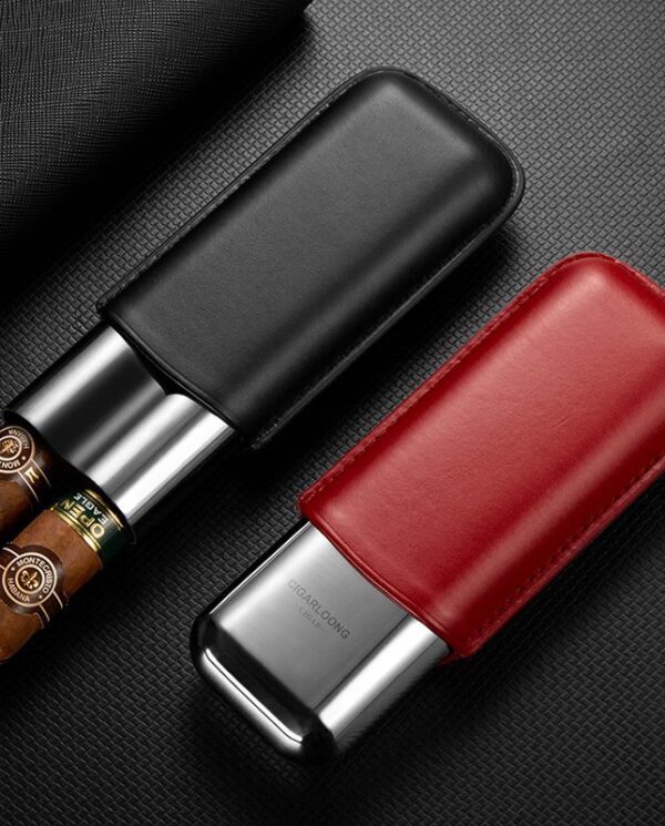 CL042 Two leather-encased metal cigar lighters, one black and one red, resting on a textured surface.