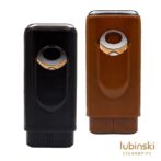 Two leather Lubinski cigar accessories in black and brown with a circular metal ring clasp at the top.