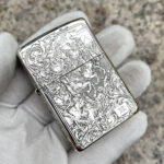 Four Horsemen Revelation five-side sterling silver Zippo lighter – front view showing the Four Horsemen of the Apocalypse in detailed scroll engraving