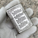 Four Horsemen Revelation five-side sterling silver Zippo lighter – reverse view showing Book of Revelation text within an ornamental frame