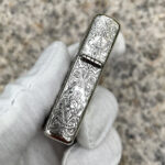 Four Horsemen Revelation five-side sterling silver Zippo lighter – hinge-side engraving with angelic figure and flowing scrollwork