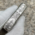 Four Horsemen Revelation five-side sterling silver Zippo lighter – opposite side with angel, emblem, and five-side ornament