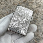 Four Horsemen Revelation five-side sterling silver Zippo lighter – angled front view of the riders and Revelation-themed engraving