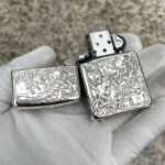 Four Horsemen Revelation five-side sterling silver Zippo lighter – open front view showing the Four Horsemen artwork, engraved lid, and Zippo insert