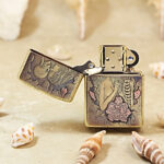Open Beauty and Skulls Zippo Armor lighter showing the windproof insert and front design