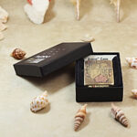 Full presentation view of the engraved Beauty and Skulls Zippo Armor lighter