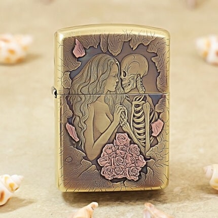 High-polish brass Zippo Armor lighter with engraved beauty, skull and floral artwork