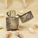 Open brass Zippo Armor lighter showing an alternate view of the mythological engraving