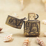 Open Grotto Buddha Zippo Armor lighter showing the windproof insert and front design