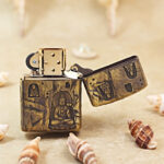 Open brass Zippo Armor lighter showing an alternate view of the spiritual engraving