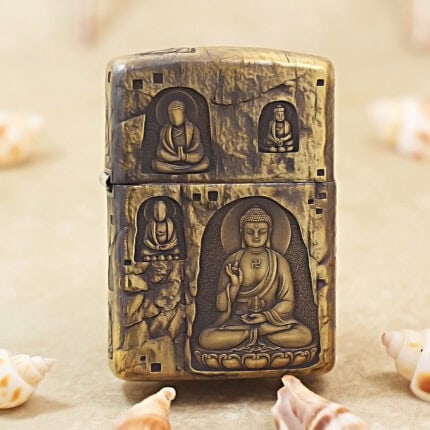 High-polish brass Zippo Armor lighter with engraved Grotto Buddha artwork