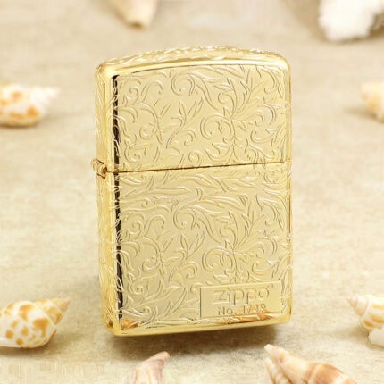 Golden arabesque Zippo with scrolling decoration and numbered front panel