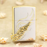Rear of the two-tone Angel Wings lighter with gold-tone scroll lines and raised wing