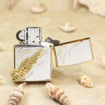 Open rear view of the two-tone Angel Wings Zippo with gold-tone feather emblem