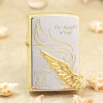 Two-tone Angel Wings Zippo with silver-tone front panel, gold-tone wing and XX edition marking