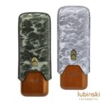 Two Lubinski cigar cases with wood bottoms and patterned fabric covers in dark and light gray, displayed side by side