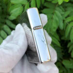 Camel Wides limited-edition sterling silver Zippo lighter – hinge-side view of the polished Regular sterling silver case