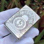 White Tara five-side sterling silver Zippo lighter – reverse view showing the Buddhist mantra wheel and sacred geometric engraving