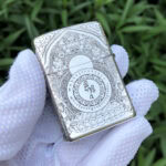 White Tara five-side sterling silver Zippo lighter – angled reverse view of the mantra wheel and ornate Buddhist border