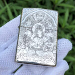 White Tara five-side sterling silver Zippo lighter – front view of White Tara, lotus seat, and engraved halo