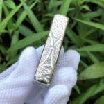 White Tara five-side sterling silver Zippo lighter – opposite side view with continuous Buddhist botanical engraving