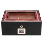 Cigar humidor with glass lid, wood trim, and a digital humidity display reading 67%.