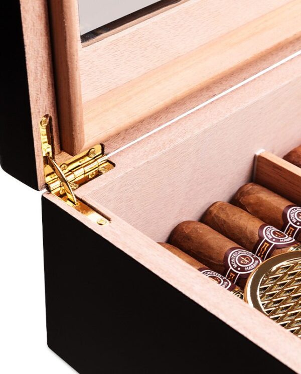 CH024-03 Open wooden cigar humidor showing cigars arranged inside and a gold hinge on the lid