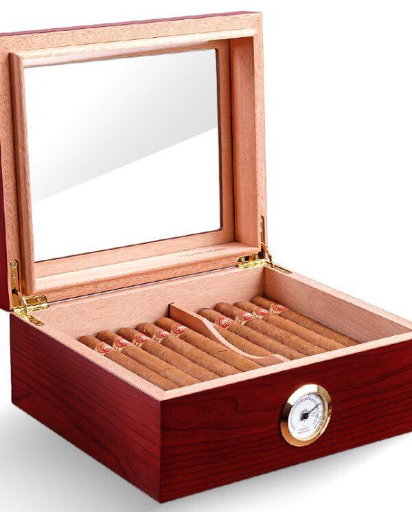 Wooden cigar humidor with open lid, rows of cigars inside, and a round hygrometer on the front.