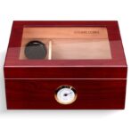 Polished mahogany cigar humidor with a glass lid and a round hygrometer on the front.