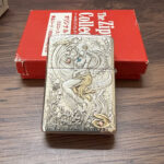 Ghost-mermaid relief with blue accent on the sterling silver Zippo Armor lighter