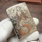 King of Ghosts red-tailed mermaid sterling silver Zippo Armor lighter, close view