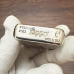 Close-up of the sterling silver base marking on the mermaid Zippo Armor lighter