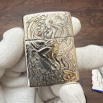 Two-tone mermaid relief across the King of Ghosts sterling silver lighter