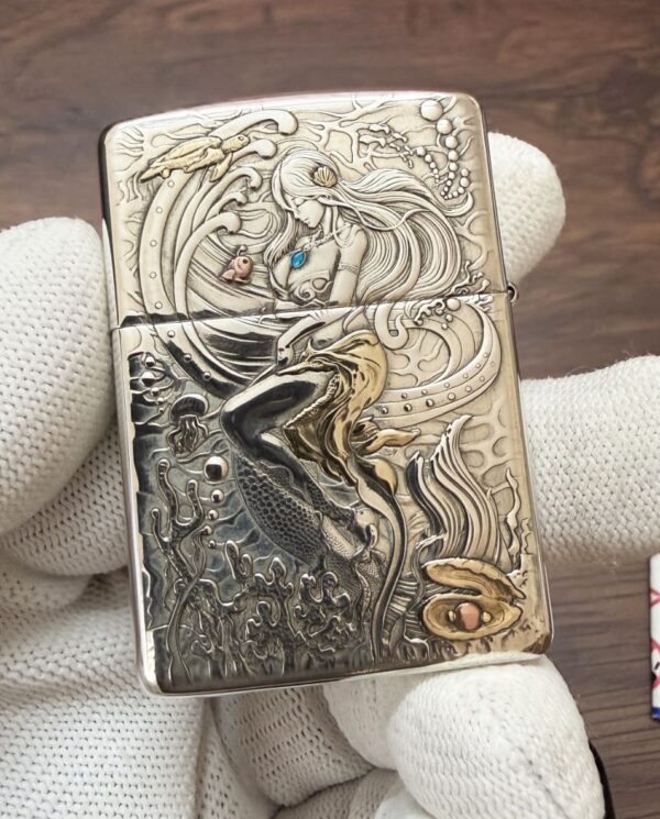 KZ003_17 Ornate Zippo lighter with an underwater fantasy scene: a mermaid with blue pendant, sea creatures, and swirling coral.