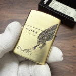 Reverse biomechanical artwork on the H. R. Giger Alien Zippo case
