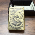 Tubular biomechanical forms across the H. R. Giger Zippo artwork
