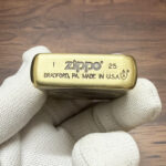 H. R. Giger Museum inscription detail on the Alien Zippo design