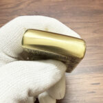 Lid engraving on the H. R. Giger Alien brass Zippo lighter