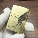 Armor base stamp detail on the brushed-brass Alien Zippo