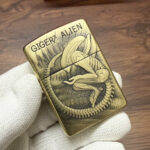 H. R. Giger Alien brushed-brass Zippo Armor lighter with original box