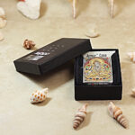 Full presentation view of the engraved White Tara Zippo Armor lighter