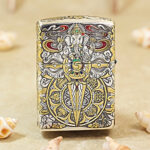 Close-up of the engraved Indian elephant artwork on the two-tone Zippo Armor case