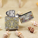 Open silver-plated Zippo Armor lighter showing an alternate view of the elephant engraving