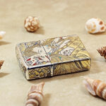 Angled detail of the Nine-Tailed Fox Zippo Armor lighter with selective gold accents