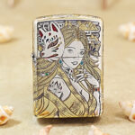 Silver-plated Zippo Armor lighter with engraved nine-tailed fox artwork and gold inlay