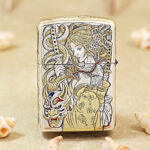 Close-up of the female-warrior engraving and gold accents on the Zippo Armor case