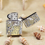 Open silver-plated Zippo Armor lighter showing an alternate side of the female-warrior design