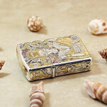 Angled detail of the Female Warriors Zippo Armor lighter with silver and gold contrast