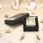 Open Beauty and Skull Zippo Armor lighter presented with its black Zippo box