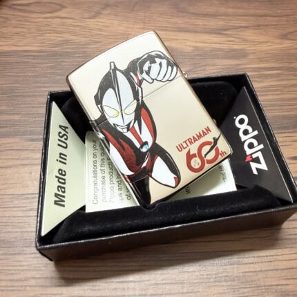 Front of the Ultraman Zippo with red, black and white character artwork and 60th logo